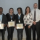 From right: Chairman and CEO Leo Denault; Senior Vice President, General Tax Counsel Joe Henderson; and Tax Associate Beverly Johns join students for a photo at the scholarship certificate presentation in April.