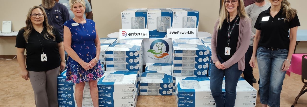 Entergy Texas employees prepare to distribute fans at the United Board of Missions in Port Arthur, Texas.