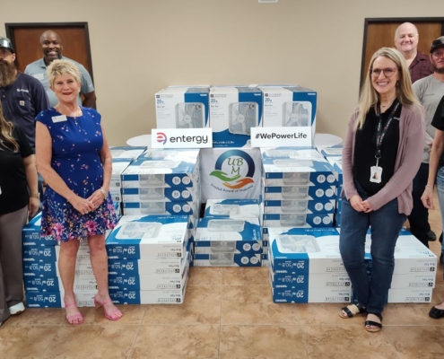 Entergy Texas employees prepare to distribute fans at the United Board of Missions in Port Arthur, Texas.