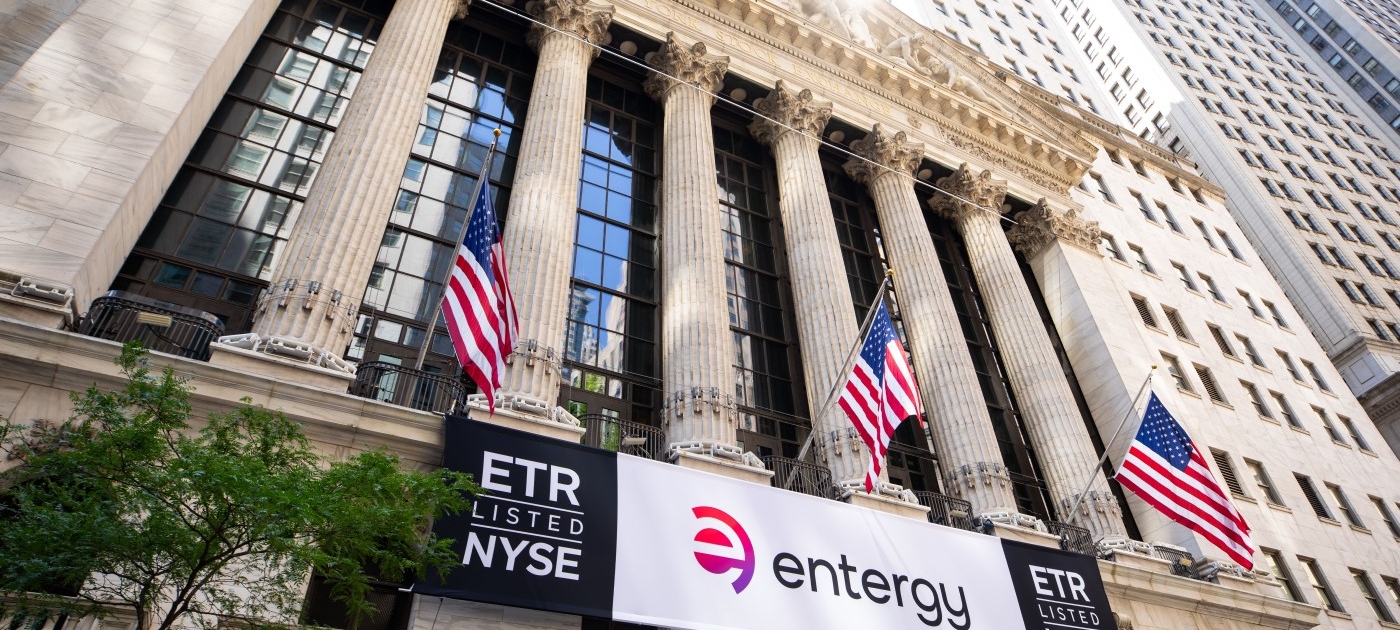 Entergy stock symbol and logo signs at the New York Stock Exchange