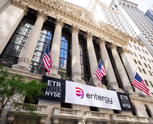 Entergy stock symbol and logo signs at the New York Stock Exchange