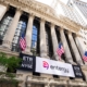 Entergy stock symbol and logo signs at the New York Stock Exchange