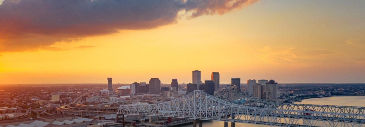 A ship is under the New Orleans bridge in the evening from above