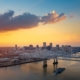 A ship is under the New Orleans bridge in the evening from above