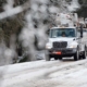 Utility bucket trucks lined up on iced over road in Vicksburg, Mississippi